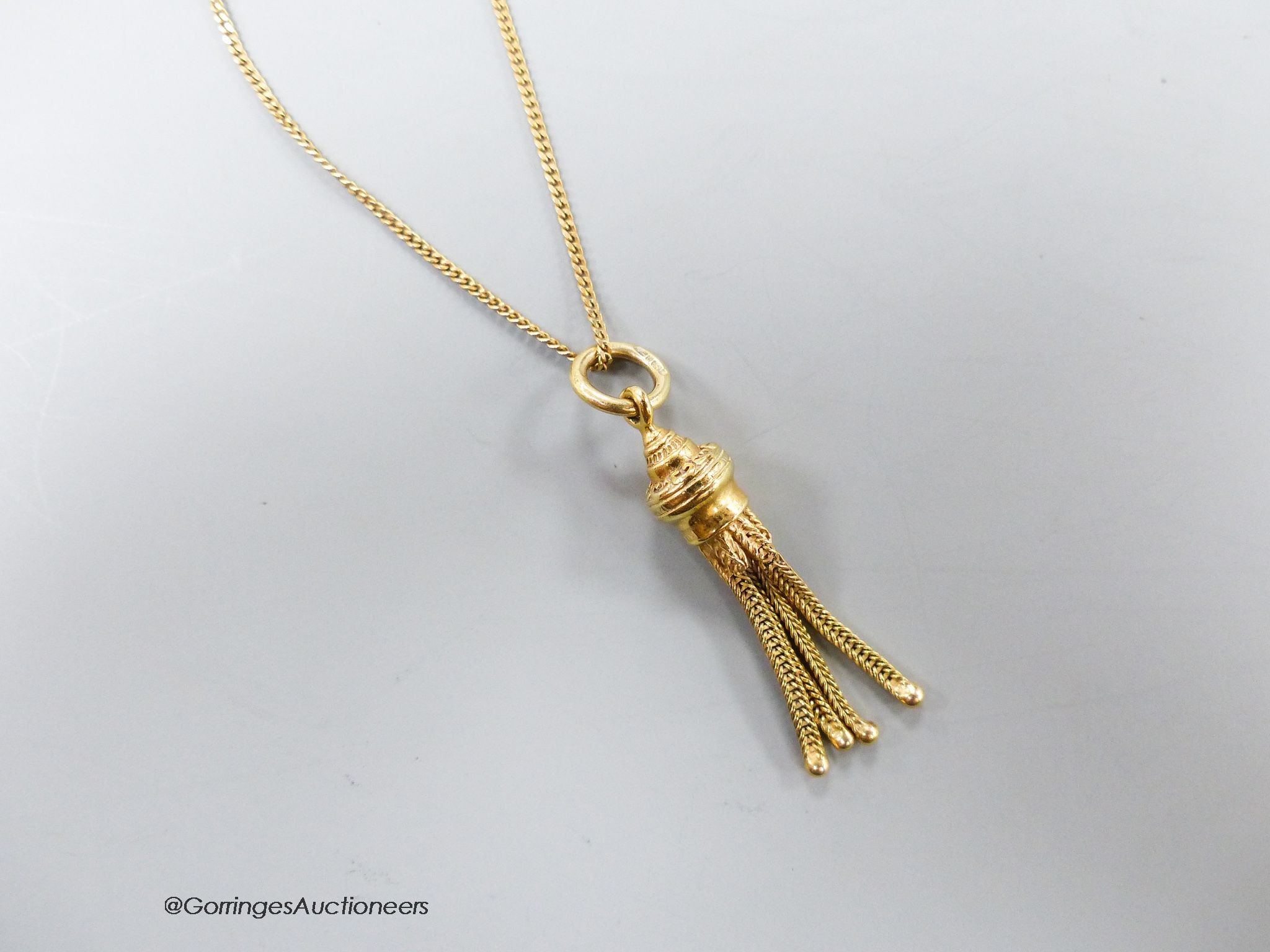 A 9ct gold tassel pendant on 9ct gold fine chain, 5.1 grams.